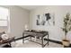 Stylish home office featuring a modern desk, decorative art, and ample natural light at 6068 Beeler Ct, Denver, CO 80238