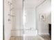 Bright and modern walk-in shower featuring sleek fixtures and contemporary tile at 6068 Beeler Ct, Denver, CO 80238