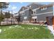 Large backyard with artificial turf, trampoline, and a basketball area at 11765 Perry St, Westminster, CO 80031