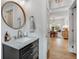 Modern bathroom with marble vanity and gold fixtures at 11765 Perry St, Westminster, CO 80031