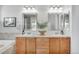 Elegant bathroom with double sinks and a soaking tub at 11765 Perry St, Westminster, CO 80031