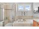 Clean bathroom with a shower and separate bathtub at 11765 Perry St, Westminster, CO 80031