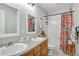 Clean bathroom with double sinks and a shower/tub combo at 11765 Perry St, Westminster, CO 80031