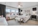 Well-lit bedroom with a queen-size bed and workspace at 11765 Perry St, Westminster, CO 80031