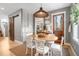 Charming breakfast nook with a round table and white chairs, adjacent to kitchen at 11765 Perry St, Westminster, CO 80031