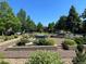 Landscaped community garden with benches and flowerbeds at 11765 Perry St, Westminster, CO 80031