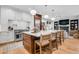 Open concept kitchen with an island and modern finishes at 11765 Perry St, Westminster, CO 80031