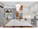 Spacious kitchen with island, white cabinets and stainless steel appliances at 11765 Perry St, Westminster, CO 80031