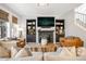 Bright living room with fireplace and built-in shelving at 11765 Perry St, Westminster, CO 80031