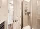 Contemporary bathroom with a glass-enclosed shower featuring modern fixtures and a neutral color palette at 15747 Willow Way, Thornton, CO 80602