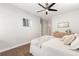 Bright bedroom with a ceiling fan and hardwood floors at 12935 Lafayette St # B, Thornton, CO 80241