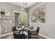 Cozy dining area with modern table and chairs, and a sliding door to the outside at 12935 Lafayette St # B, Thornton, CO 80241