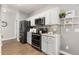 Well-equipped kitchen with modern appliances, granite countertops and plenty of storage at 12935 Lafayette St # B, Thornton, CO 80241