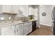 Stylish kitchen with granite countertops, tile backsplash, and stainless steel appliances at 12935 Lafayette St # B, Thornton, CO 80241