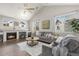 Bright living room featuring vaulted ceilings, a fireplace, and comfortable seating at 12935 Lafayette St # B, Thornton, CO 80241
