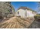 Backyard view of the home and yard, with wooden fence at 8791 Troon Village Pl, Lone Tree, CO 80124