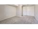 Bedroom featuring gray carpet, neutral walls, and a double door closet at 8791 Troon Village Pl, Lone Tree, CO 80124