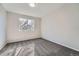 Bedroom featuring gray carpet and a window offering a view of the outside at 8791 Troon Village Pl, Lone Tree, CO 80124