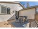 Outdoor deck featuring a dining set and decorative rug, offering a perfect space for outdoor meals and gatherings at 8791 Troon Village Pl, Lone Tree, CO 80124