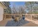 Outdoor deck furnished with a seating area and decorated with a patterned rug, perfect for entertaining at 8791 Troon Village Pl, Lone Tree, CO 80124