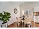 Cozy dining area with modern furnishings, adjacent to the kitchen and featuring a sliding door to the deck at 8791 Troon Village Pl, Lone Tree, CO 80124