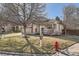 Inviting single-Gathering home featuring a covered porch, manicured lawn, and convenient street access at 8791 Troon Village Pl, Lone Tree, CO 80124