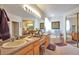 Large bathroom with double sinks, big mirrors, soaking tub, and generous vanity space at 1851 Ute Creek Dr, Longmont, CO 80504