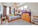 Bedroom featuring a ceiling fan and natural light at 1851 Ute Creek Dr, Longmont, CO 80504