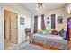Cozy bedroom featuring a ceiling fan and natural light at 1851 Ute Creek Dr, Longmont, CO 80504