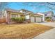 Attractive home showcasing curb appeal, a double garage, and well-kept landscaping at 1851 Ute Creek Dr, Longmont, CO 80504
