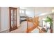Open loft area with staircase access and views of the dining area below at 1851 Ute Creek Dr, Longmont, CO 80504