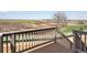 Deck view showcasing expansive backyard with scenic wetlands, golf course and nearby houses at 1965 S Coolidge Way, Aurora, CO 80018