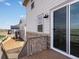 View from the wood deck showing exterior of home and spacious backyard landscaping at 1965 S Coolidge Way, Aurora, CO 80018
