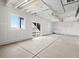 Spacious unfinished basement with large windows and sliding glass doors to backyard at 1965 S Coolidge Way, Aurora, CO 80018