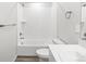 Clean bathroom featuring a tiled shower-tub combination, toilet, and vanity with sink at 1965 S Coolidge Way, Aurora, CO 80018