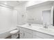 Bright bathroom with double sinks, vanity, and tiled shower-tub combination at 1965 S Coolidge Way, Aurora, CO 80018