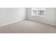 Simple bedroom with neutral carpet, window, and electrical outlets at 1965 S Coolidge Way, Aurora, CO 80018
