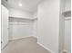Bright walk-in closet with ample storage space and metal racks for clothing and accessories at 1965 S Coolidge Way, Aurora, CO 80018