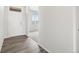 Bright entryway features wood floors, white trim and walls, and a white front door at 1965 S Coolidge Way, Aurora, CO 80018