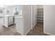 Well-lit kitchen features stainless steel appliances, ample counter space, and a convenient pantry at 1965 S Coolidge Way, Aurora, CO 80018