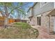 Backyard featuring a wooden fence and patio access at 4933 Altura St, Denver, CO 80239