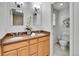 Bathroom with double sinks and vanities, plus a separate toilet and shower room at 7426 S Hudson Way, Centennial, CO 80122