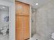 A bathroom featuring a tiled shower, and storage space, adding functionality and style at 7426 S Hudson Way, Centennial, CO 80122