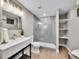 Modern bathroom featuring a glass-enclosed shower, floating vanity, and open shelving at 7426 S Hudson Way, Centennial, CO 80122