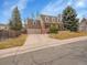 Inviting brick home with an attached two-car garage, set on a well-manicured lot at 7426 S Hudson Way, Centennial, CO 80122