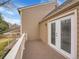 Exterior of a home with siding, white framed doors, and a balcony overlooking a green space at 7426 S Hudson Way, Centennial, CO 80122