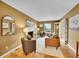 Comfortable living room features a fireplace, hardwood floors, and bright natural lighting at 7426 S Hudson Way, Centennial, CO 80122