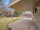 Covered patio with stone pavers, offering a comfortable outdoor living space at 7426 S Hudson Way, Centennial, CO 80122