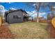 Landscaped back yard with fence and dark colored siding at 3350 S Eudora St, Denver, CO 80222