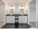 Bathroom featuring dual sinks, gold fixtures, and a modern design at 3350 S Eudora St, Denver, CO 80222